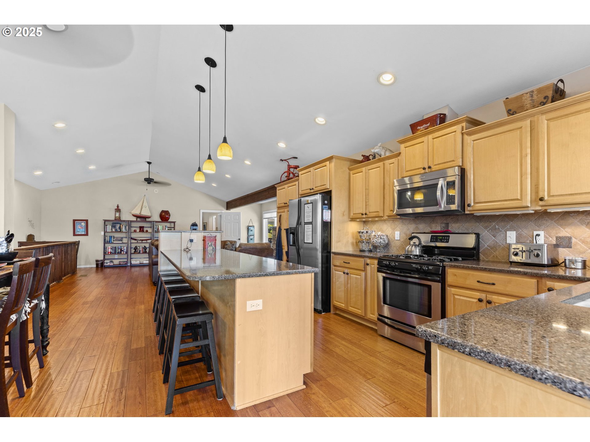238 Southwest 27th Street Newport, OR 97366 - Photo 8 of 34 a kitchen with stainless steel appliances granite countertop a sink a stove and a refrigerator