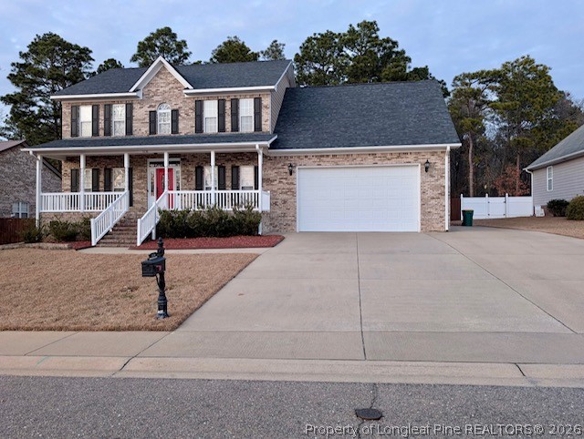 5236 Spreading Branch Road Hope Mills, NC 28348 - Photo 1 of 14 a front view of a house with yard and parking