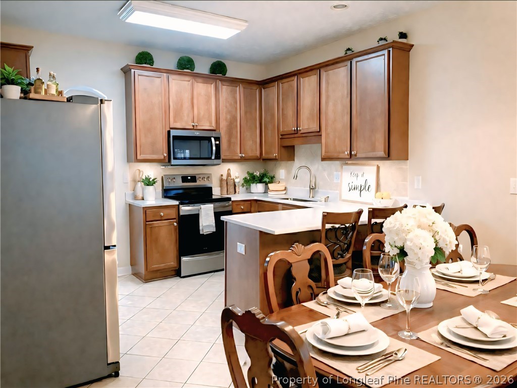 5236 Spreading Branch Road Hope Mills, NC 28348 - Photo 4 of 14 a kitchen with a sink stove and microwave