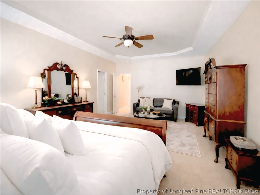 5236 Spreading Branch Road Hope Mills, NC 28348 - Photo 7 of 14 a bedroom with a bed and a flat screen tv