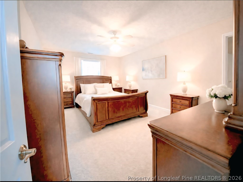 5236 Spreading Branch Road Hope Mills, NC 28348 - Photo 10 of 14 a bedroom with bed and a window