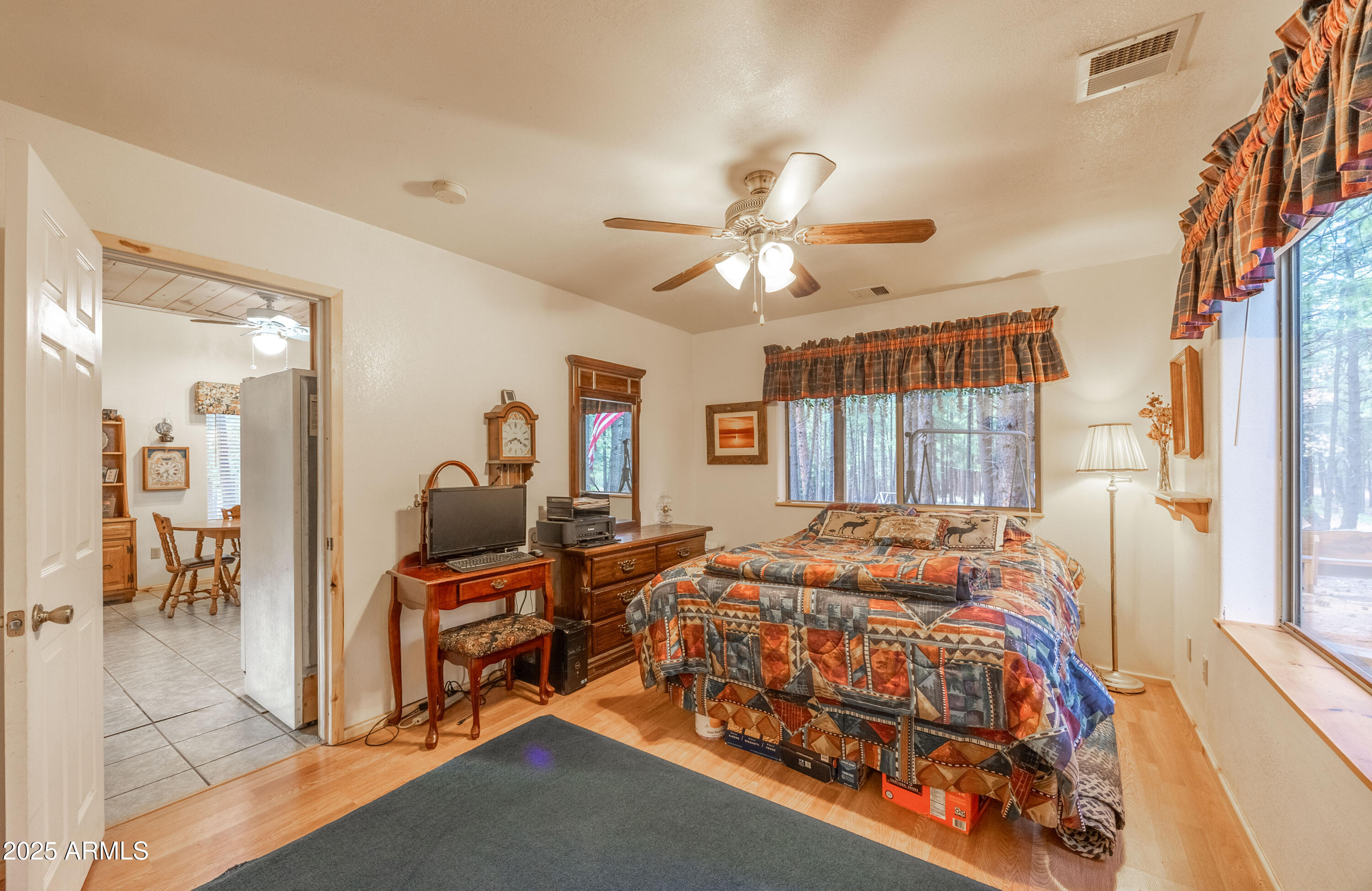 1643 Rifle Way Forest Lakes, AZ 85931 - Photo 9 of 40 a bedroom with a bed and a chandelier