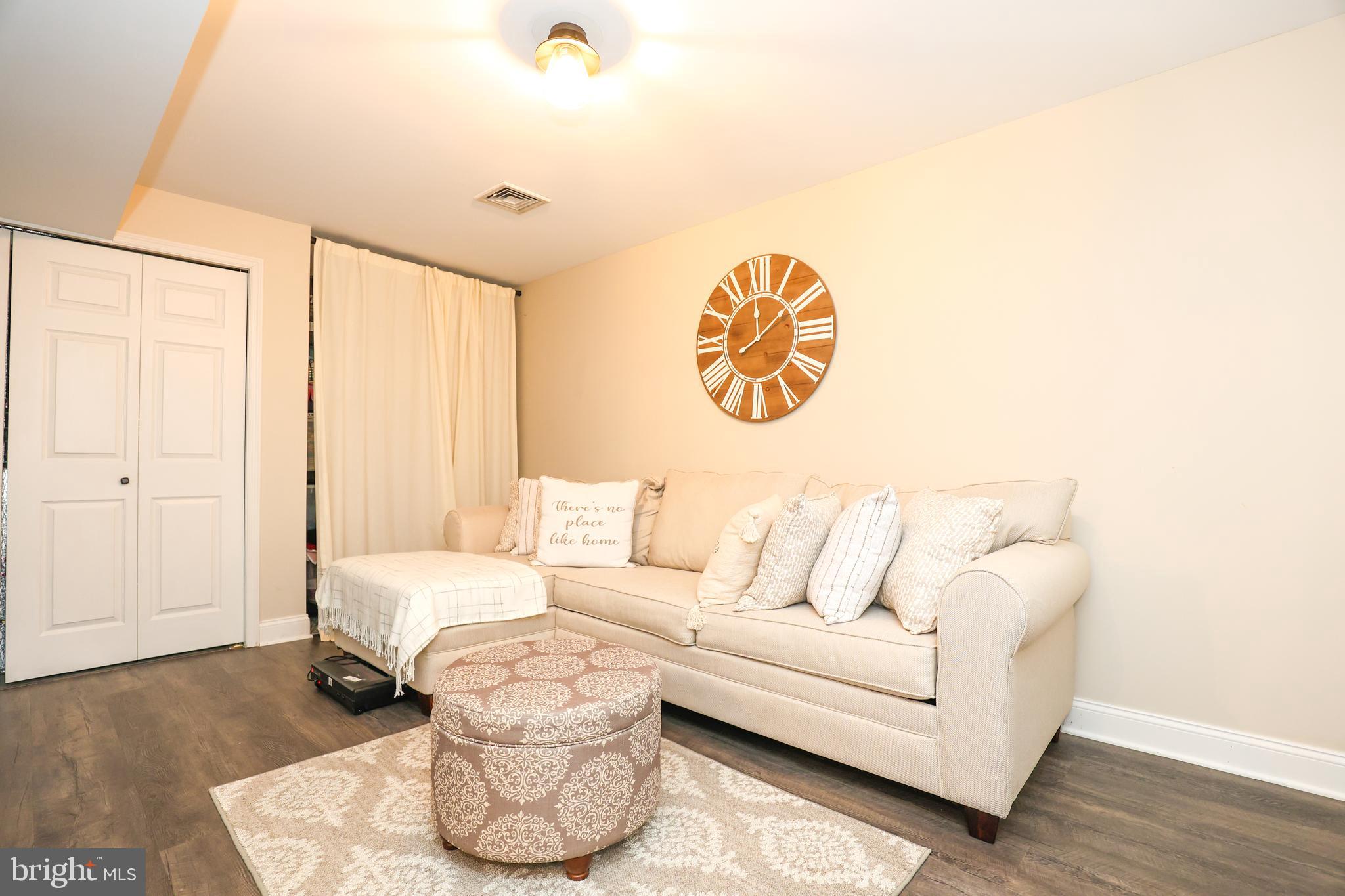 407 Crosswinds Drive Lititz, PA 17543 - Photo 14 of 18 a living room with furniture and a wooden floor