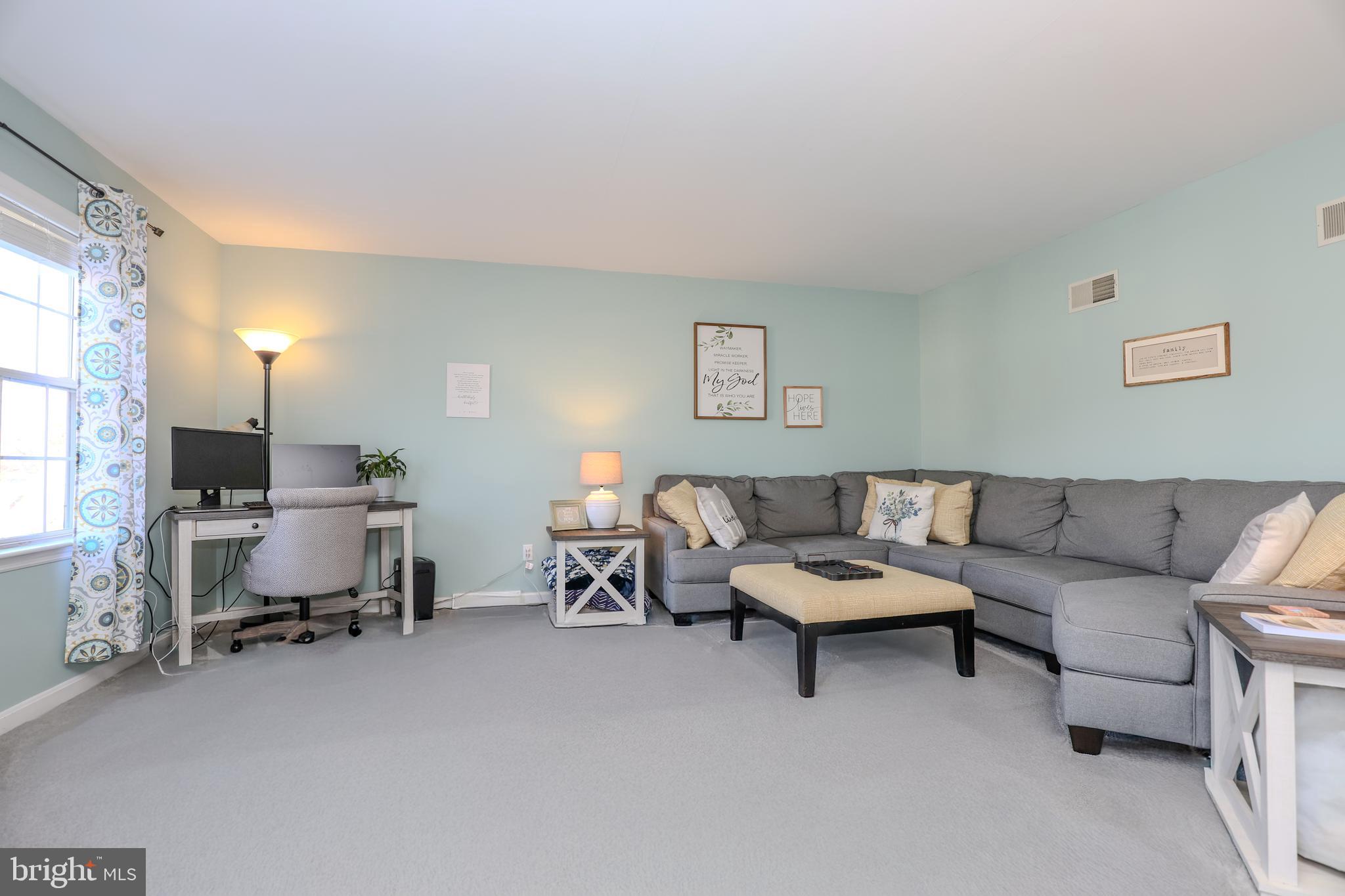 407 Crosswinds Drive Lititz, PA 17543 - Photo 7 of 18 a living room with furniture and a couch