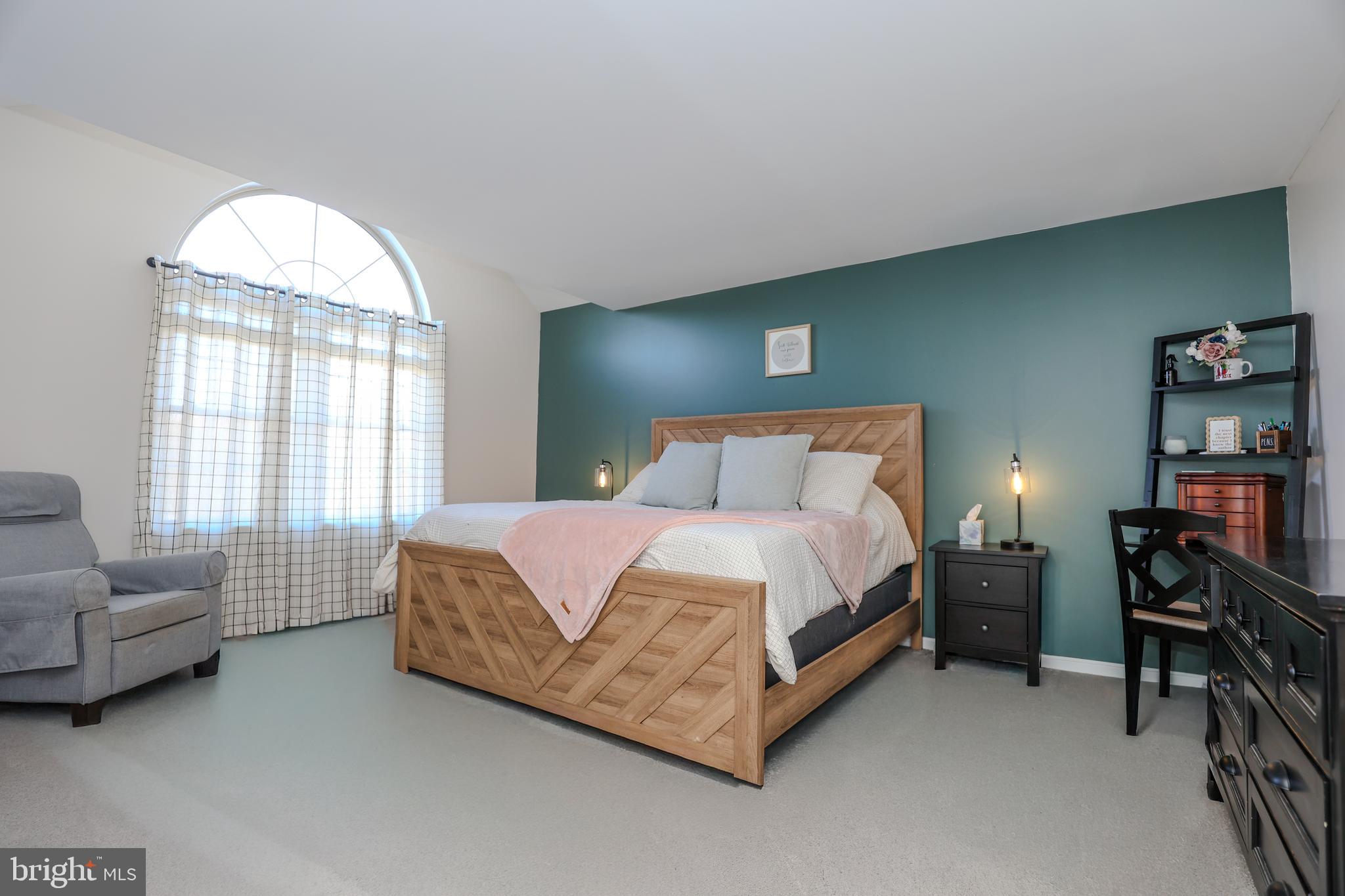 407 Crosswinds Drive Lititz, PA 17543 - Photo 10 of 18 a spacious bedroom with a bed and a couch