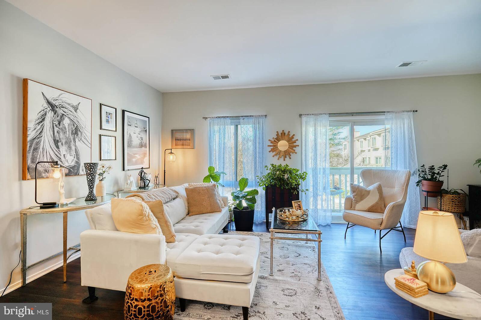 7900 Bentley Village Drive, Unit 11B Springfield, VA 22152 - Photo 4 of 42 Living room & balcony view.