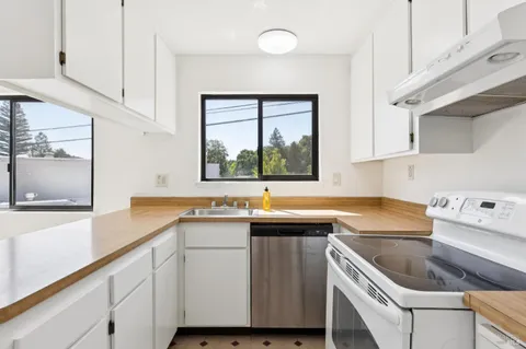 a kitchen with a sink and cabinets