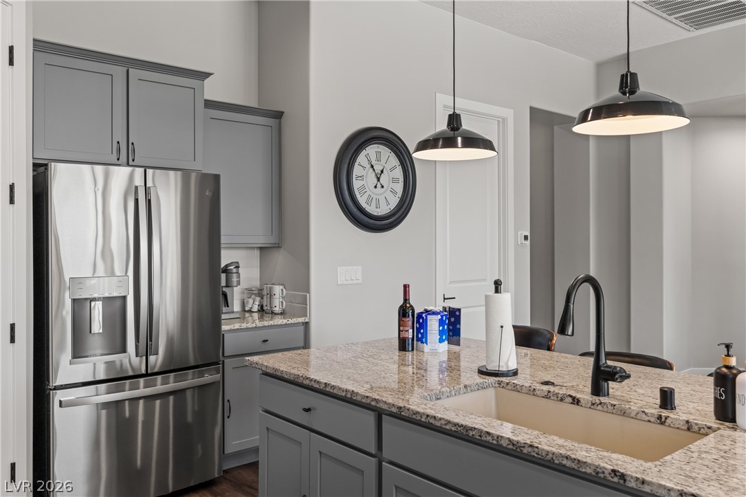 1436 Manassas Ridge Mesquite, NV 89027 - Photo 32 of 77 A gourmet kitchen offers stainless steel appliances and an expansive island with granite countertops.