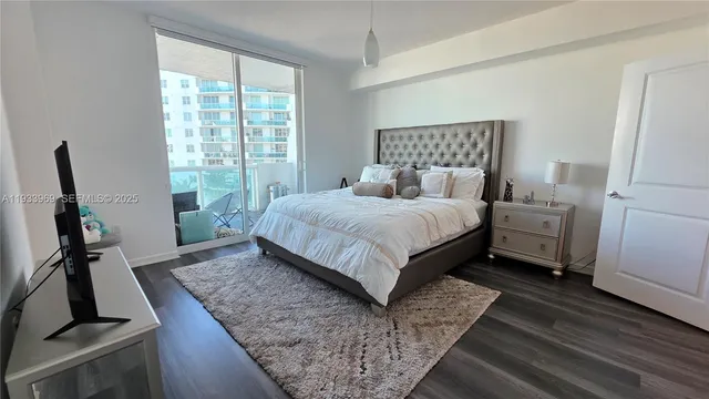 a bedroom with a bed and dresser