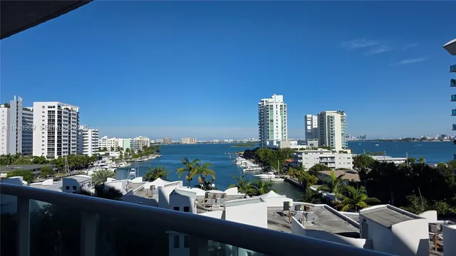 a living room with furniture wooden floor and a fireplace