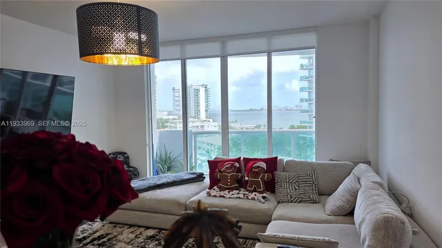 a view of a refrigerator in kitchen and wooden floor