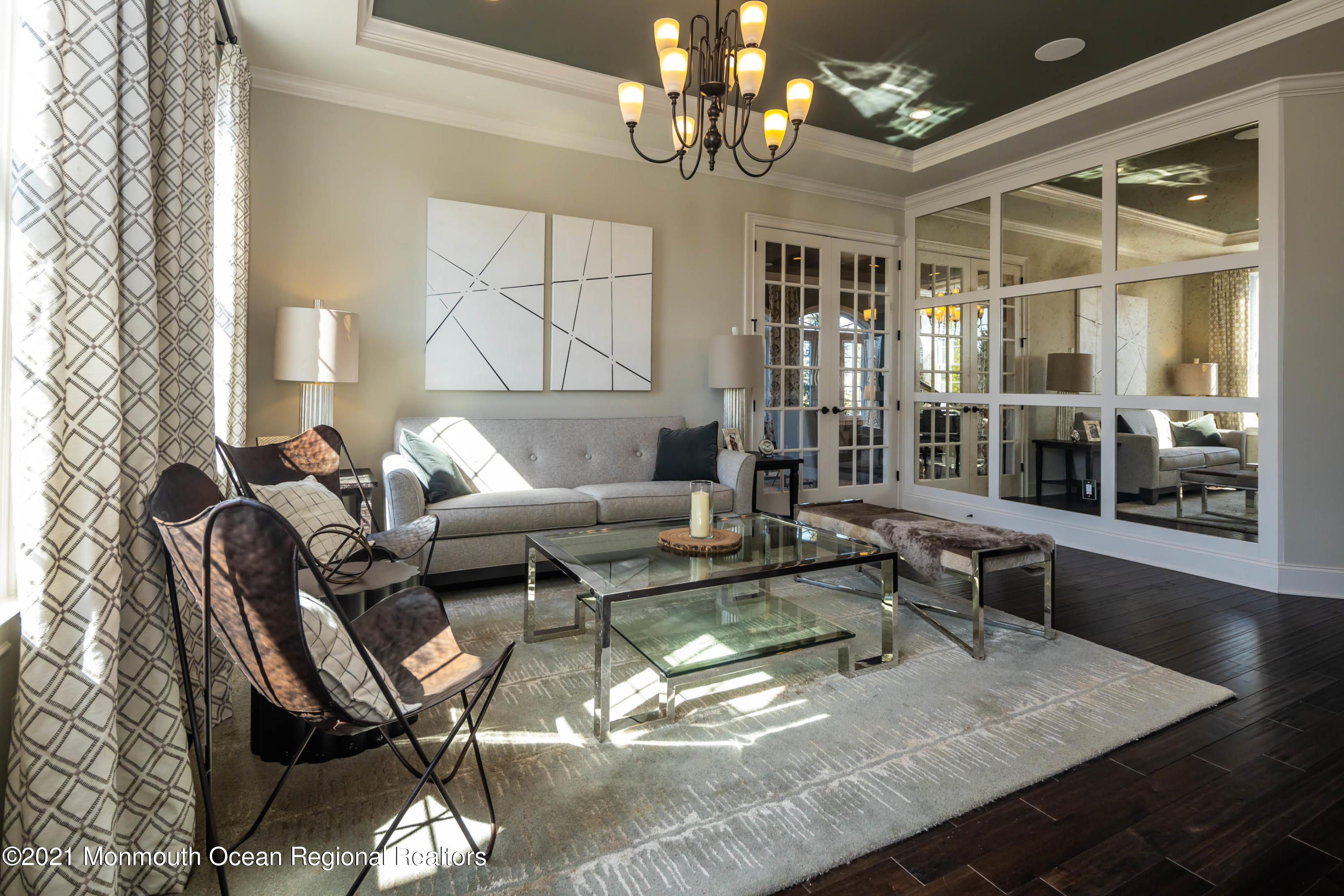 8 Strathmore Road Lincroft, NJ 07738 - Photo 13 of 76 a living room with furniture chandelier and a dining table with wooden floor
