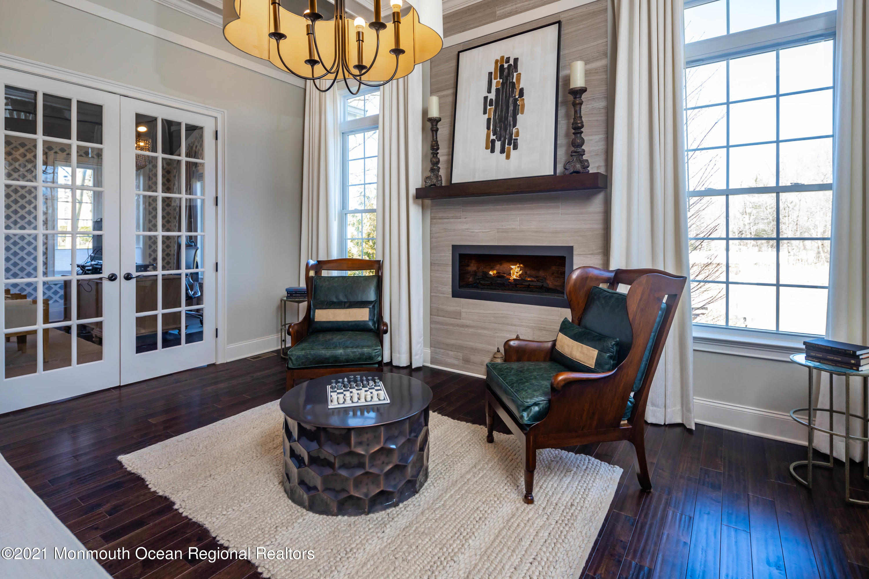 8 Strathmore Road Lincroft, NJ 07738 - Photo 23 of 76 a living room with furniture and a fireplace