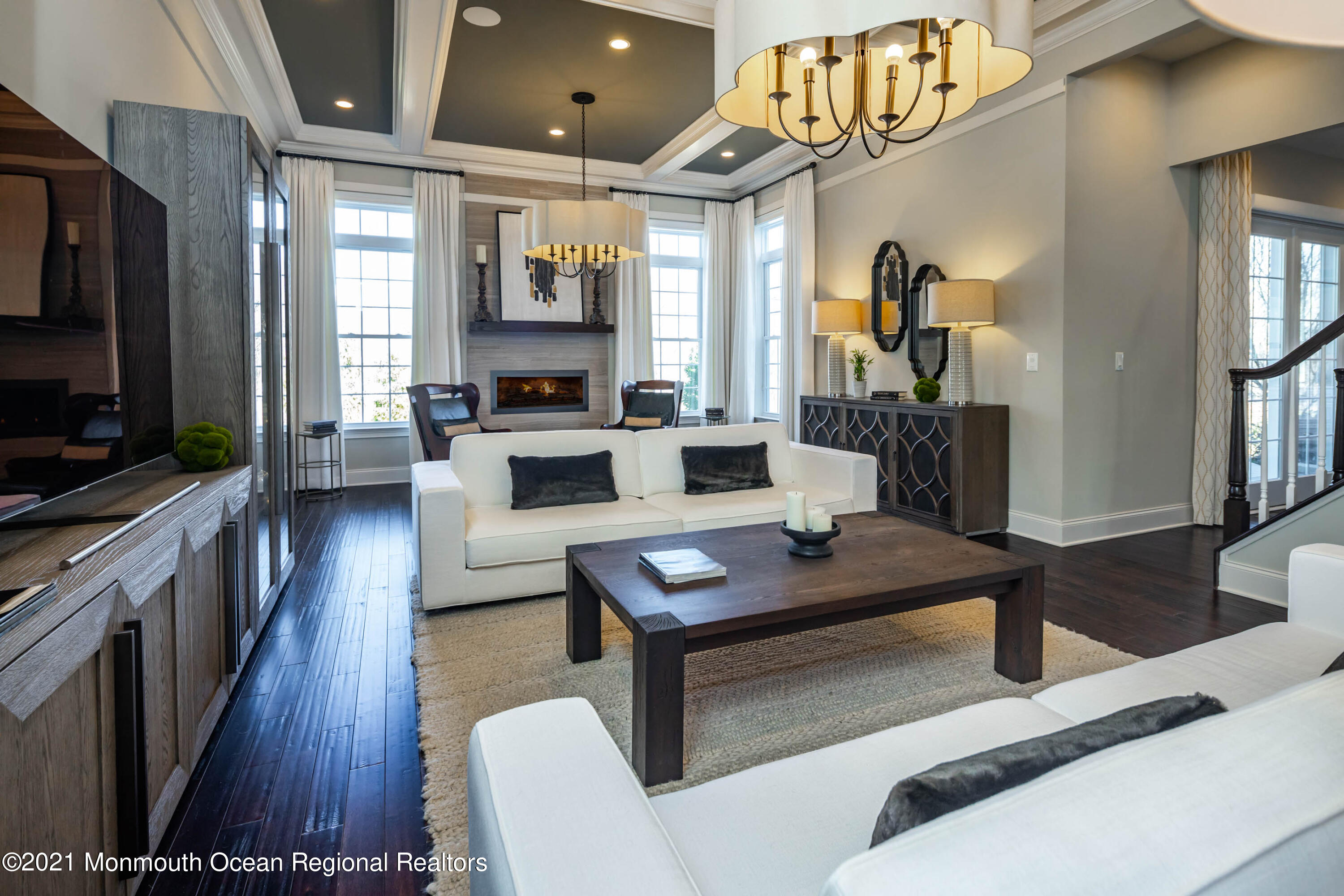8 Strathmore Road Lincroft, NJ 07738 - Photo 25 of 76 a living room with furniture a flat screen tv and a wooden floor