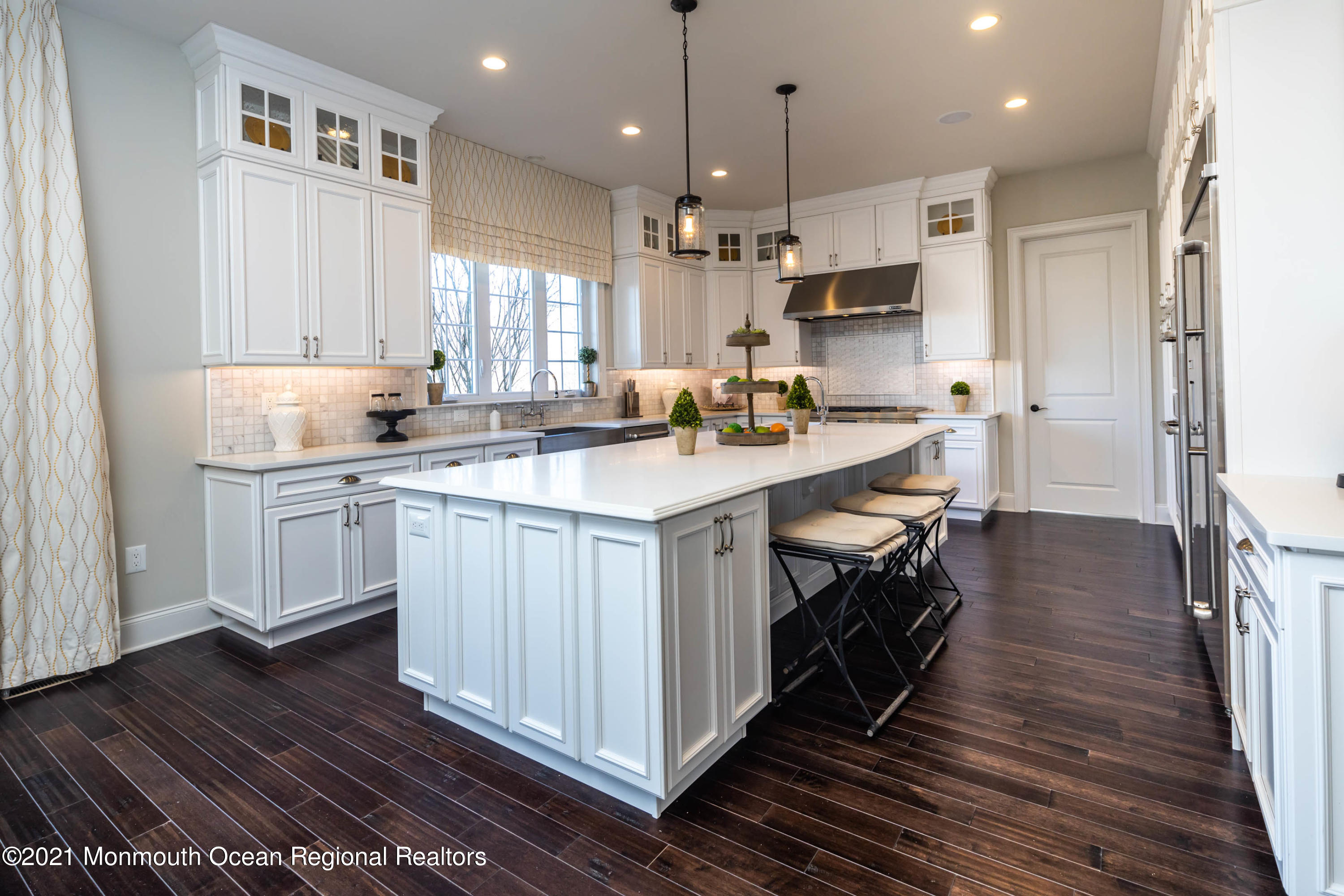 8 Strathmore Road Lincroft, NJ 07738 - Photo 28 of 76 a kitchen with a sink stove cabinets and wooden floor