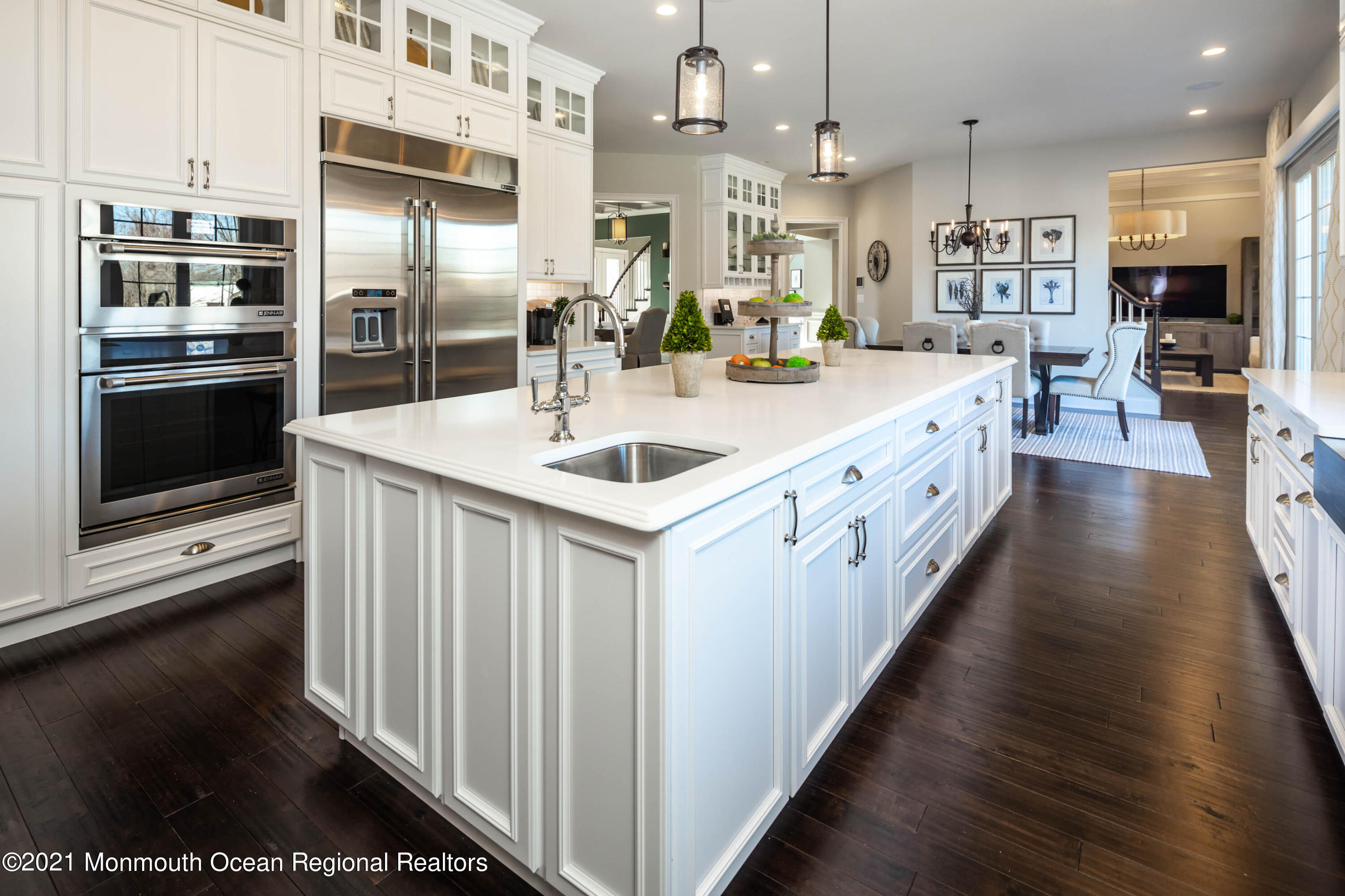 8 Strathmore Road Lincroft, NJ 07738 - Photo 30 of 76 a large white kitchen with stainless steel appliances a large counter top a stove and a refrigerator