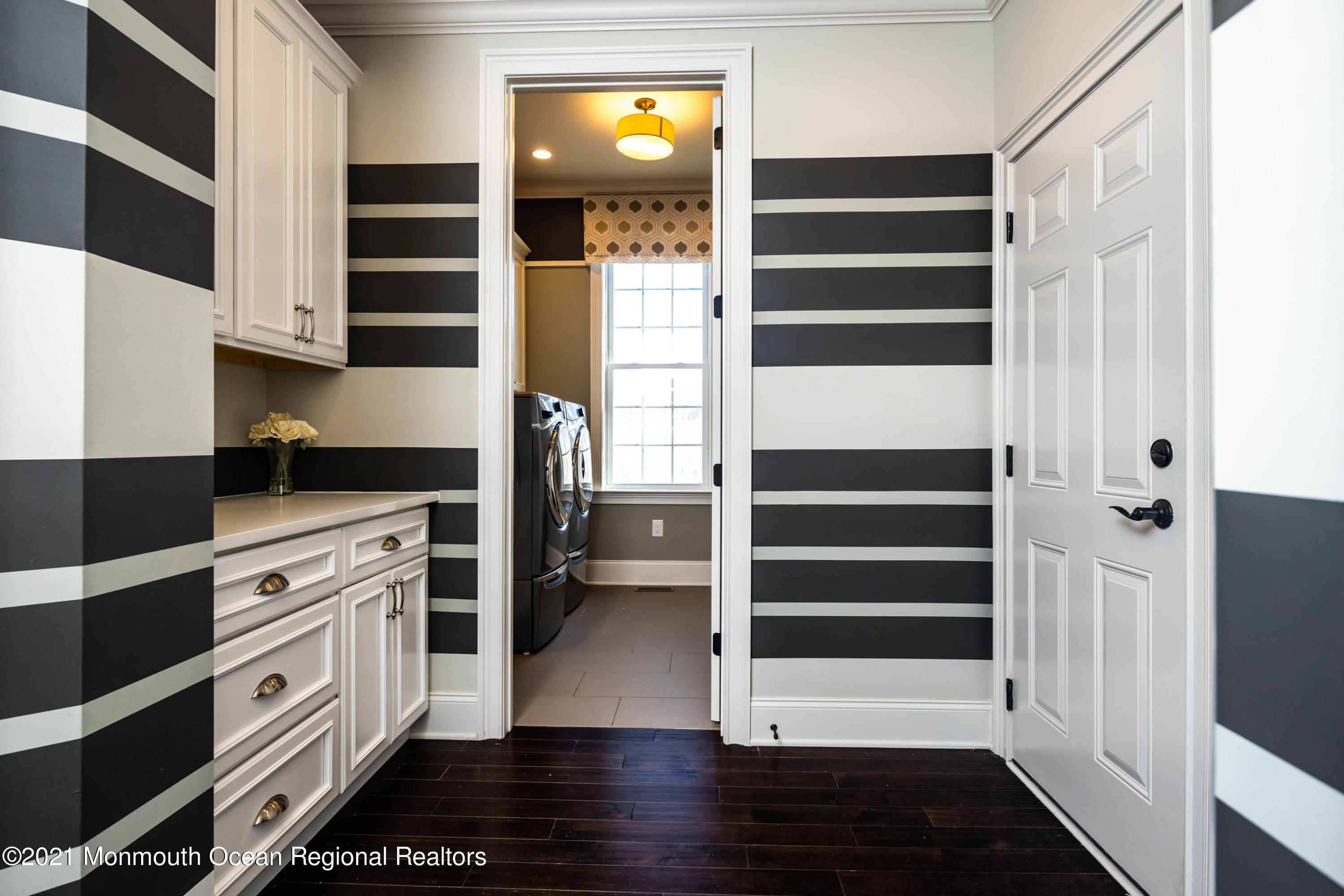 8 Strathmore Road Lincroft, NJ 07738 - Photo 37 of 76 a view of walk in closet and bedroom with wooden floor