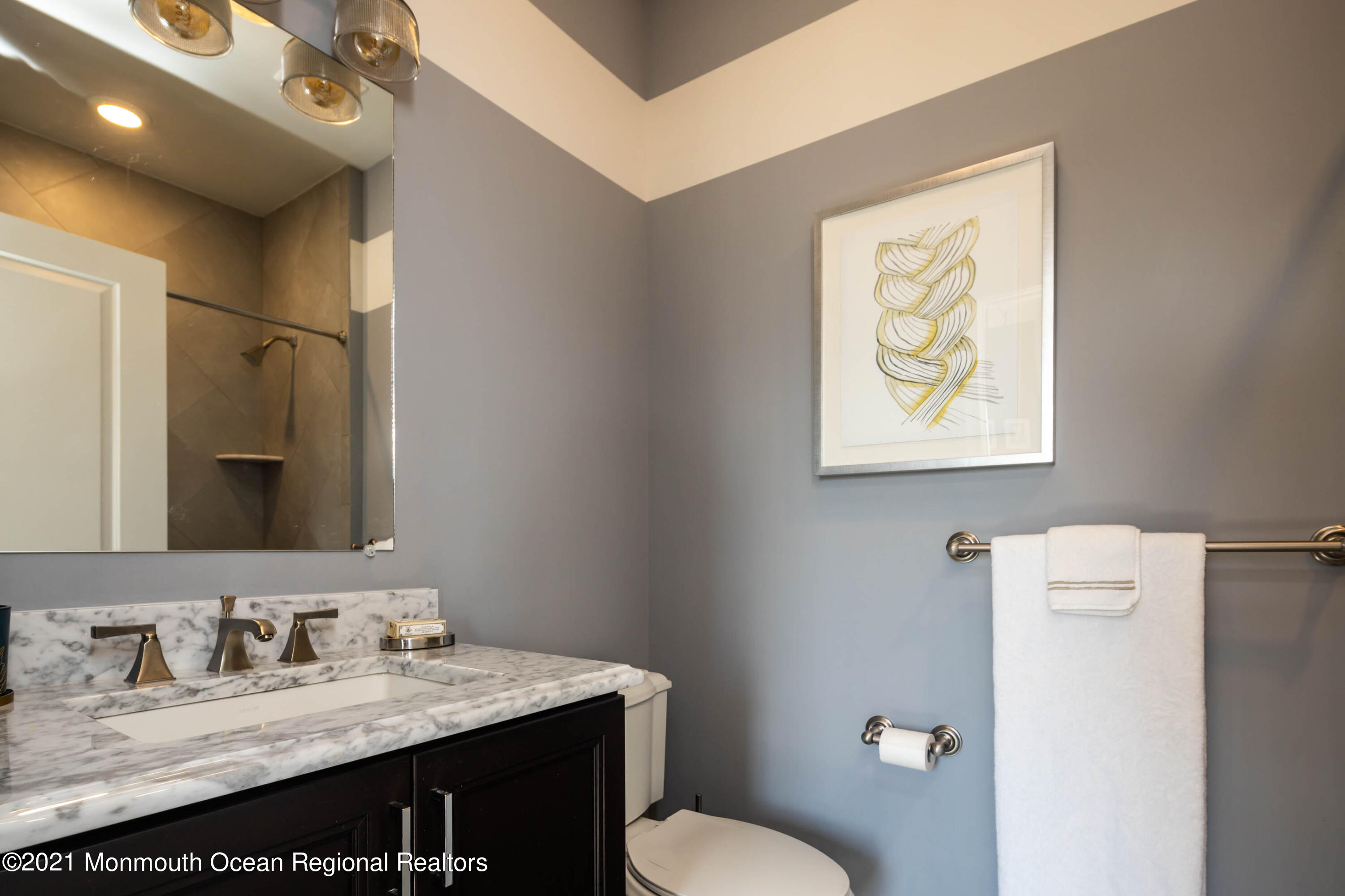 8 Strathmore Road Lincroft, NJ 07738 - Photo 42 of 76 a bathroom with a granite countertop sink toilet and mirror