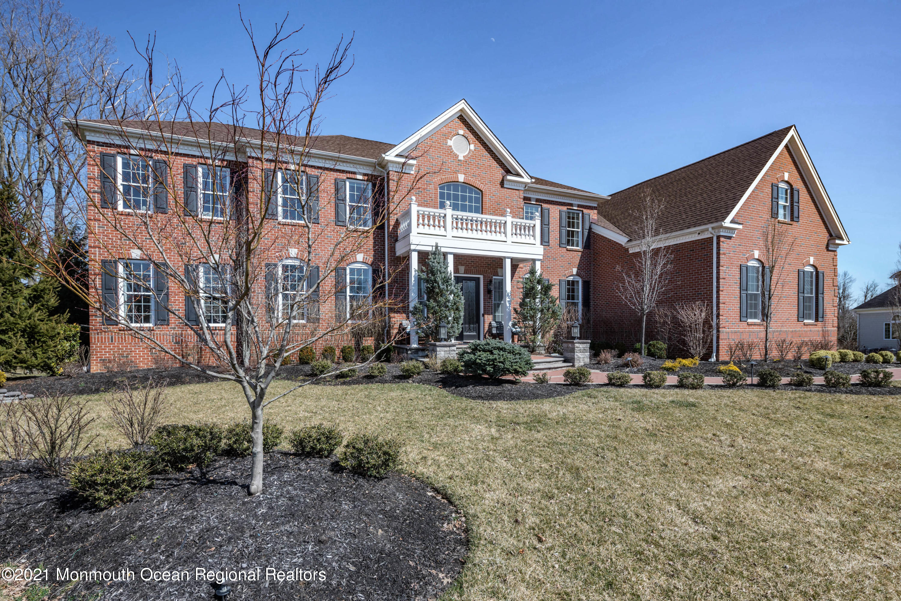 8 Strathmore Road Lincroft, NJ 07738 - Photo 6 of 76 a front view of a house with yard