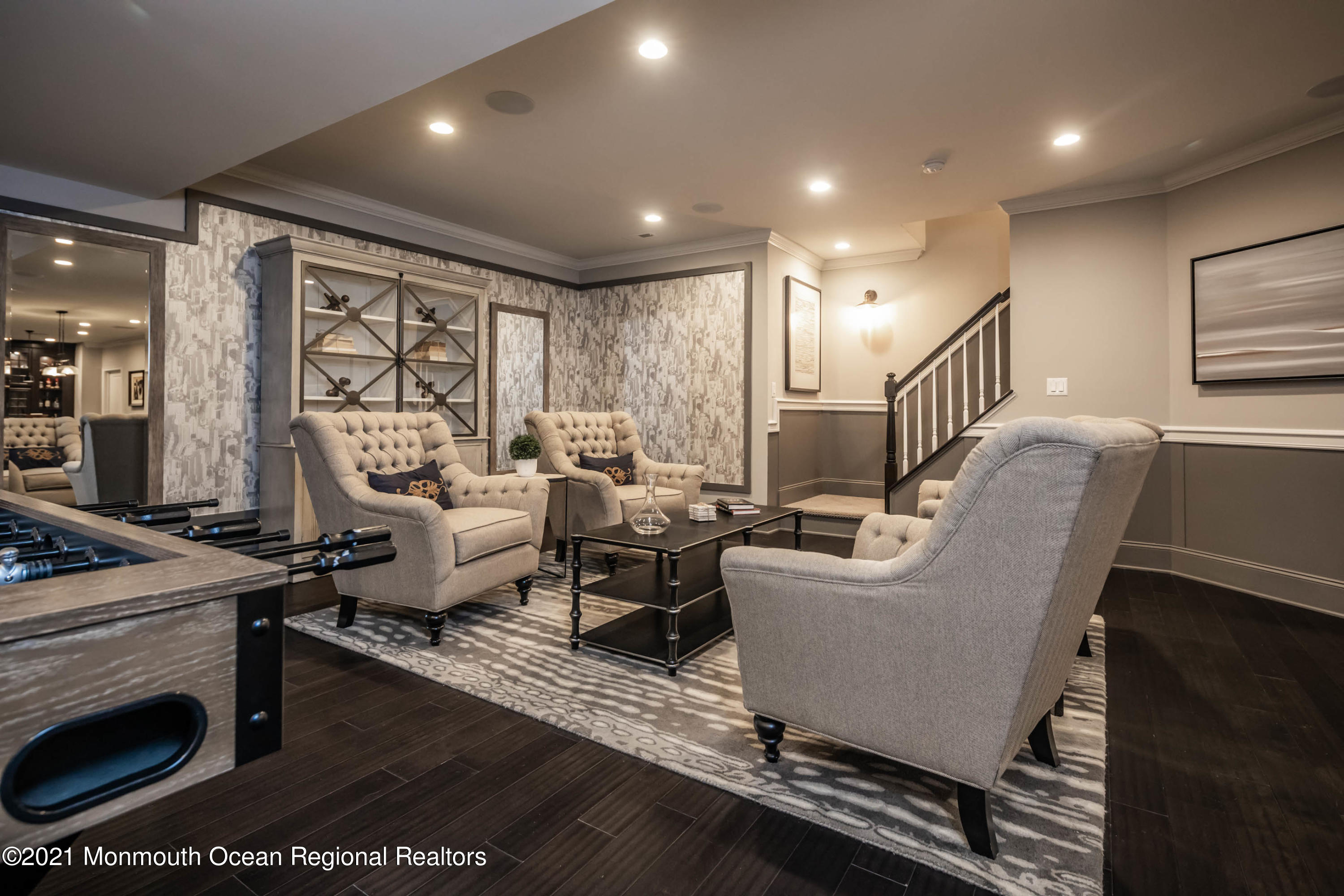 8 Strathmore Road Lincroft, NJ 07738 - Photo 59 of 76 a living room with furniture wooden floor and a fireplace