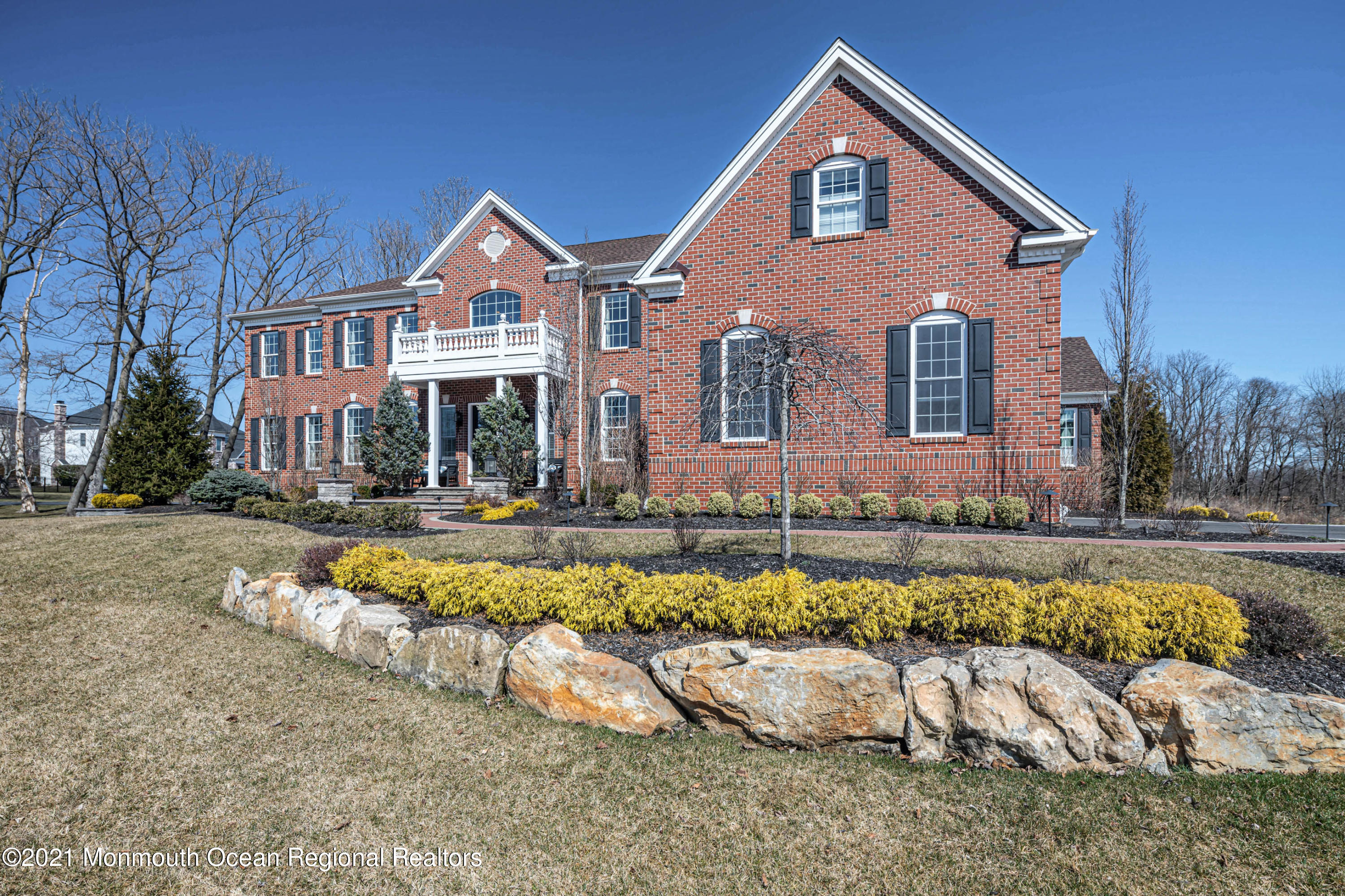 8 Strathmore Road Lincroft, NJ 07738 - Photo 7 of 76 a front view of a house with a yard outdoor seating and lake view