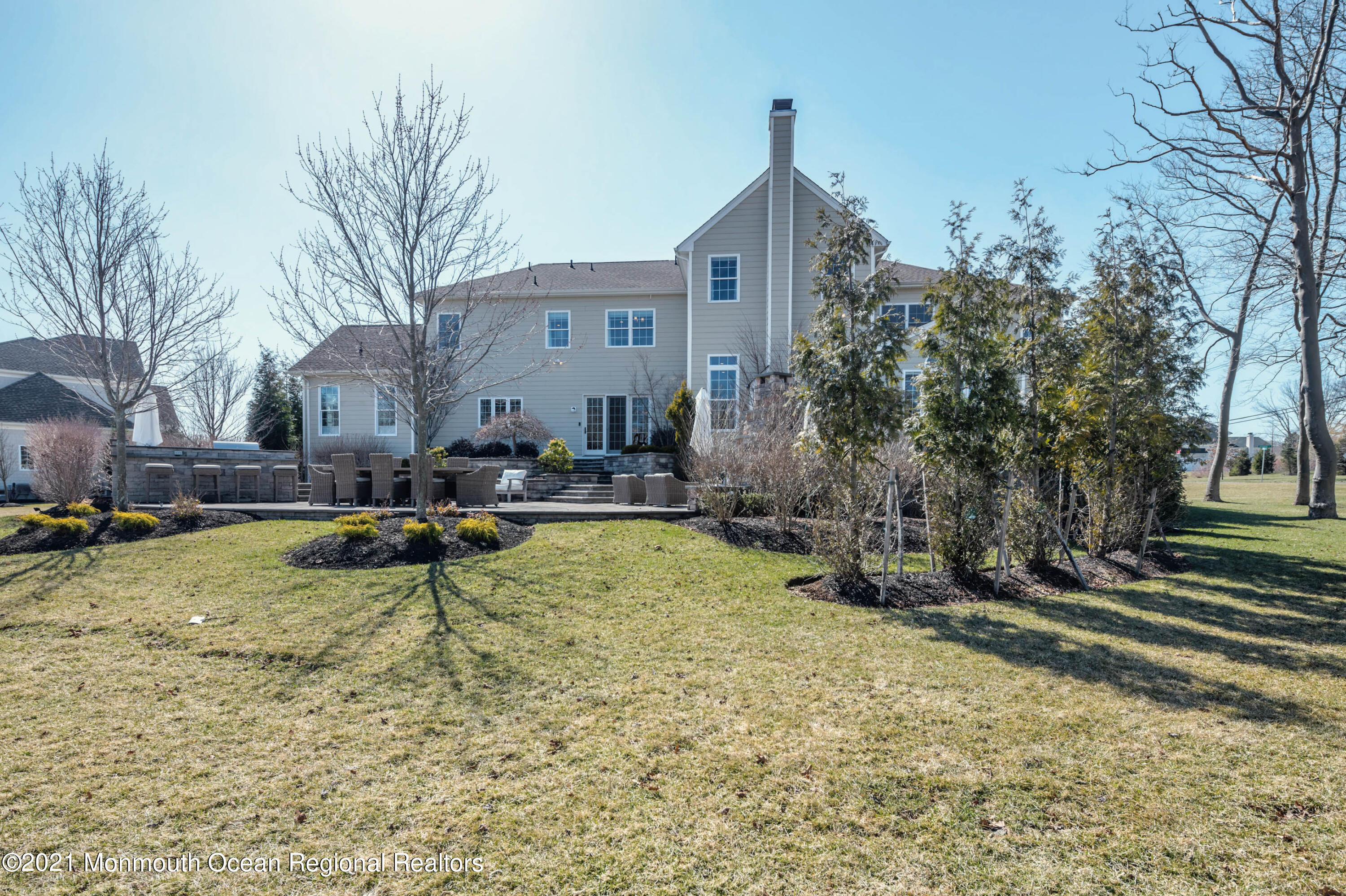 8 Strathmore Road Lincroft, NJ 07738 - Photo 65 of 76 a view of swimming pool with outdoor seating and house in the background
