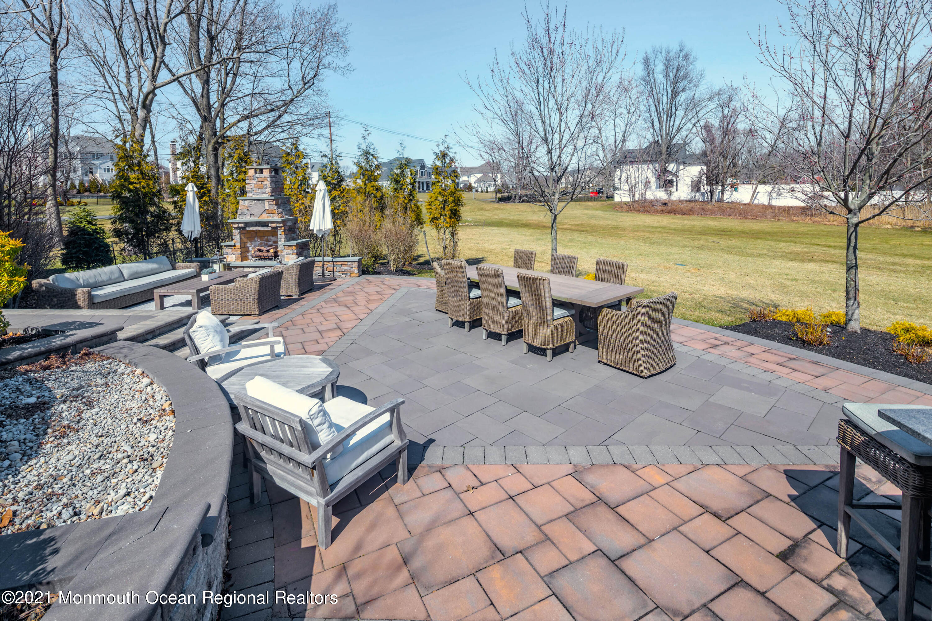 8 Strathmore Road Lincroft, NJ 07738 - Photo 66 of 76 a view of a patio with swimming pool and sitting area