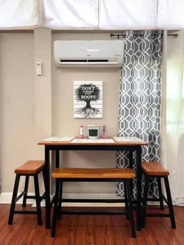 a kitchen with a stove and a chair