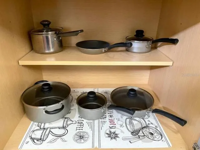 a bedroom with a bed and a flat tv screen