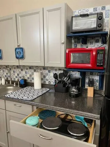 a bedroom with bed and a wooden floor