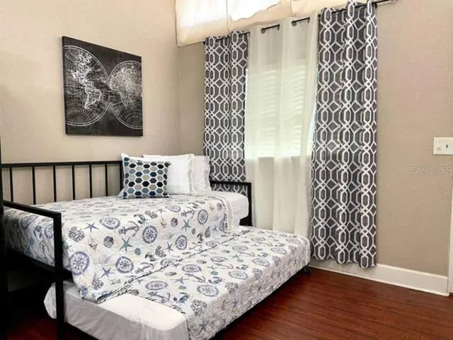 a bathroom with a shower and a sink