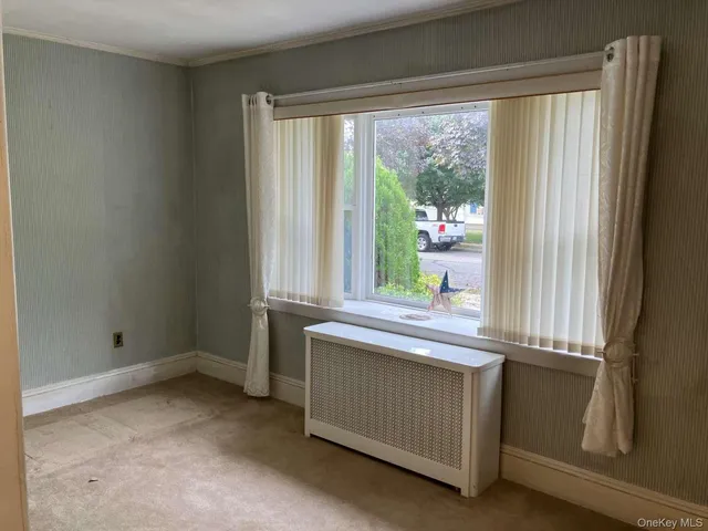 a view of cabinets and window