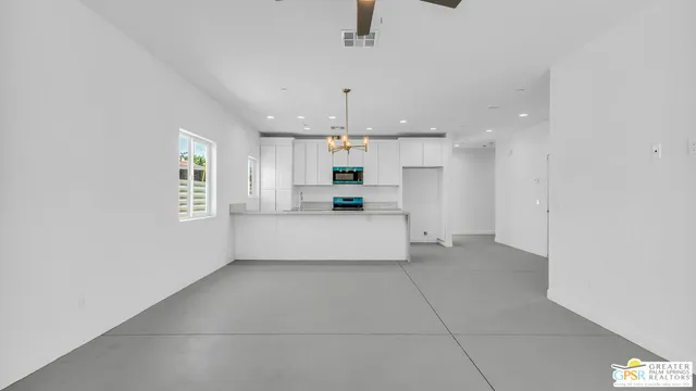 a bathroom with a toilet sink vanity and mirror