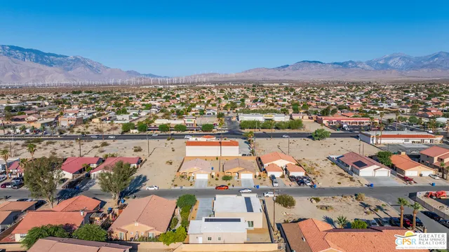 an aerial view of a house with a garden