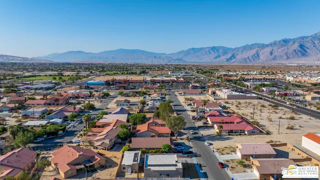 an aerial view of residential houses and outdoor space