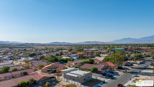 aerial view of a houses with a city view