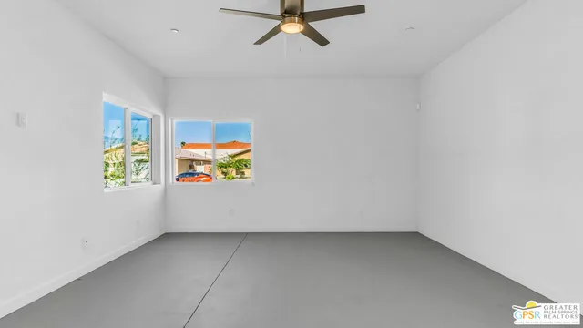 a large kitchen with a lot of counter space and stainless steel appliances