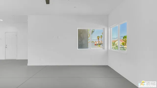 a view of an empty room and closet area