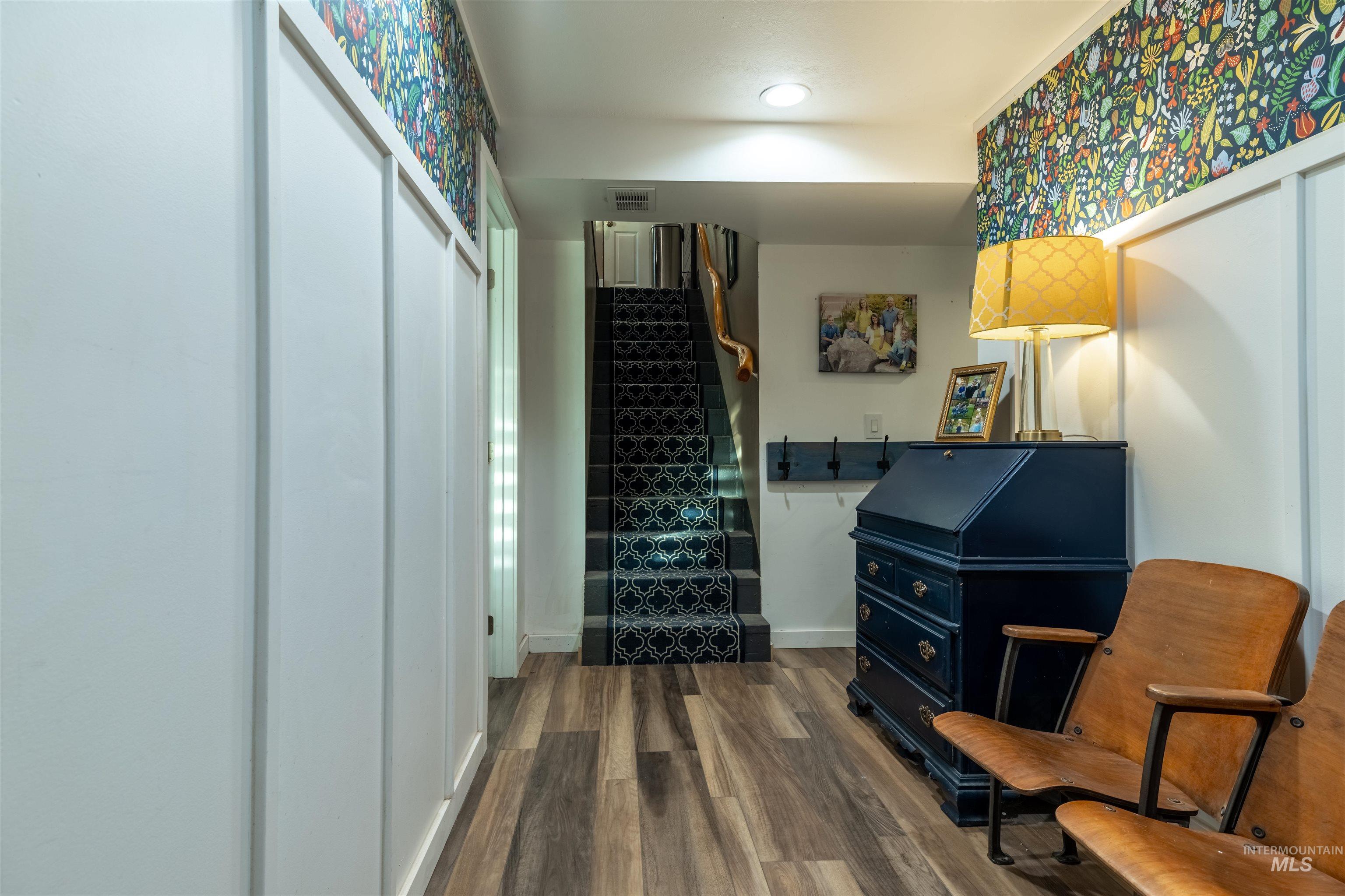 14526 Perfection Lane Caldwell, ID 83607 - Photo 11 of 24 Entryway featuring wood-finish flooring and white wainscoting