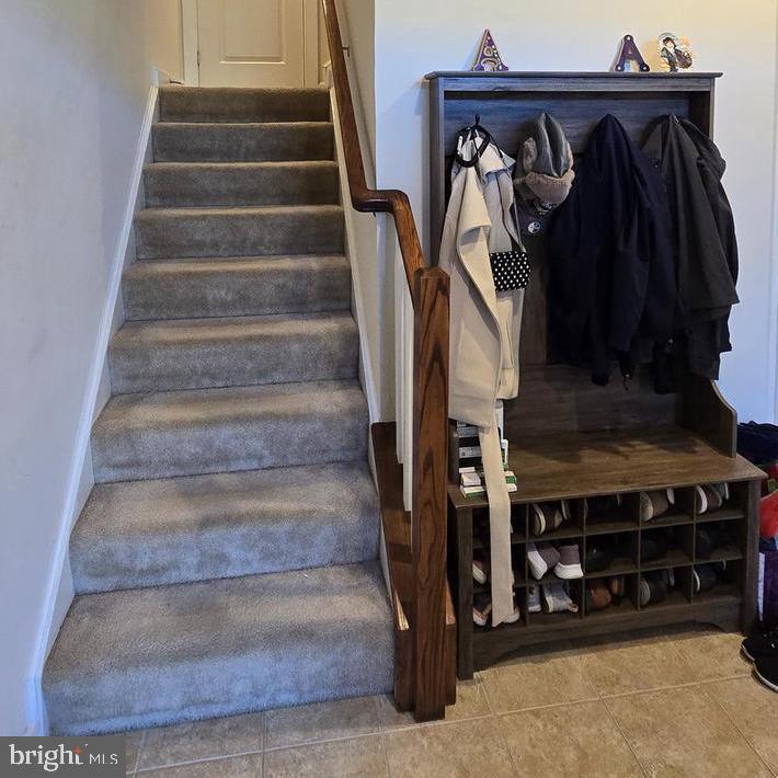 3174 Yeager Drive Herndon, VA 20171 - Photo 6 of 20 a view of walk in closet with clothes and shoes