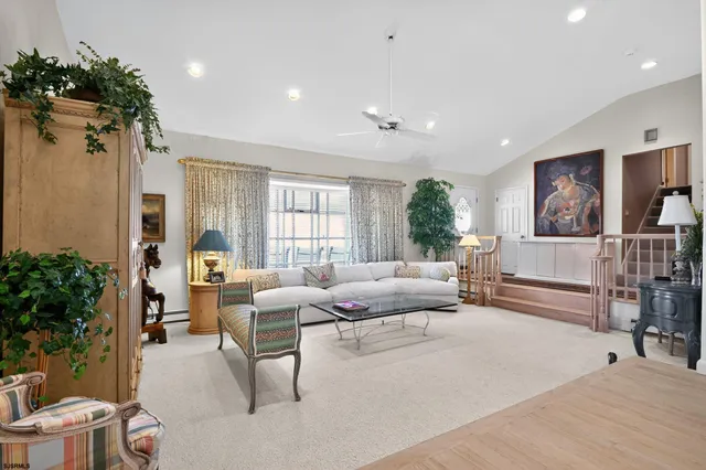 a view of a patio with table and chairs and potted plants