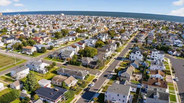 a view of a dining room with furniture and window
