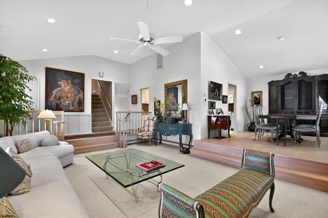 a kitchen with granite countertop a sink cabinets stainless steel appliances and a window