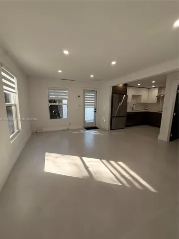 a view of a big room with windows