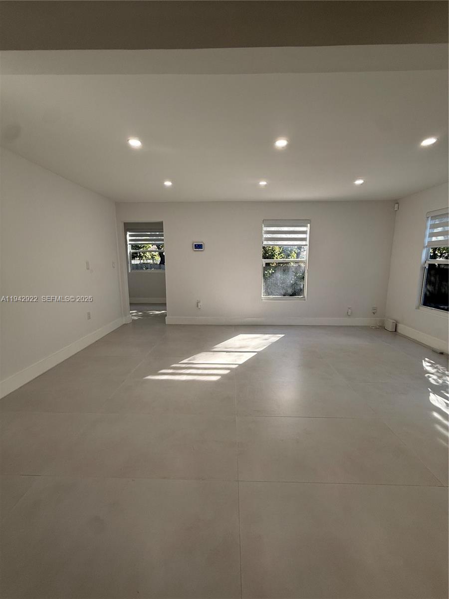 4430 Northwest 1st Avenue Miami, FL 33127 - Photo 12 of 31 wooden floor in an empty room with a window