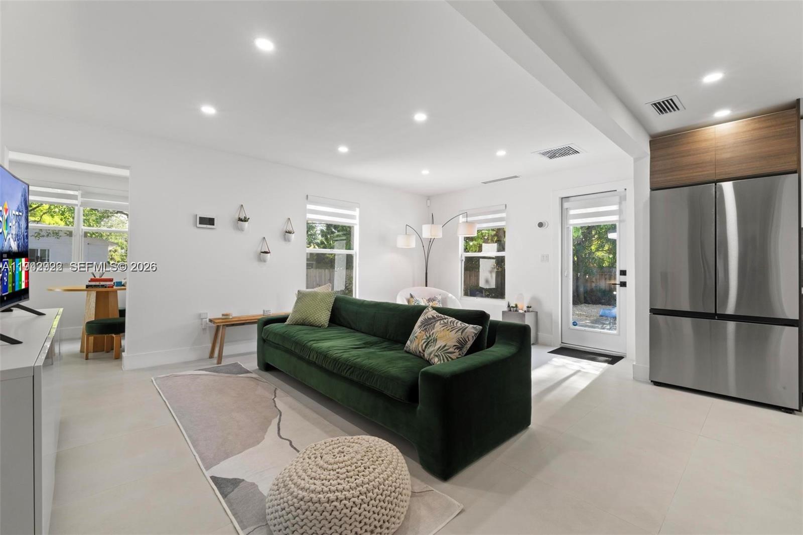 4430 Northwest 1st Avenue Miami, FL 33127 - Photo 13 of 31 a living room with furniture and a refrigerator