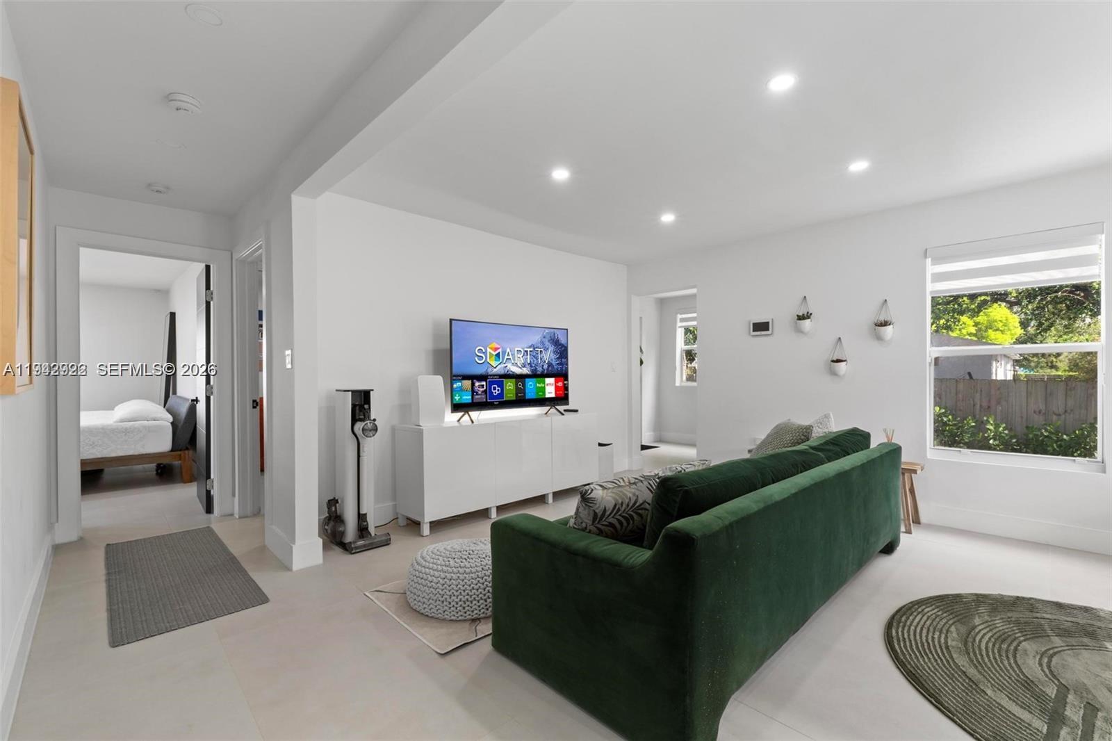 4430 Northwest 1st Avenue Miami, FL 33127 - Photo 14 of 31 a living room with furniture and a walk in closet