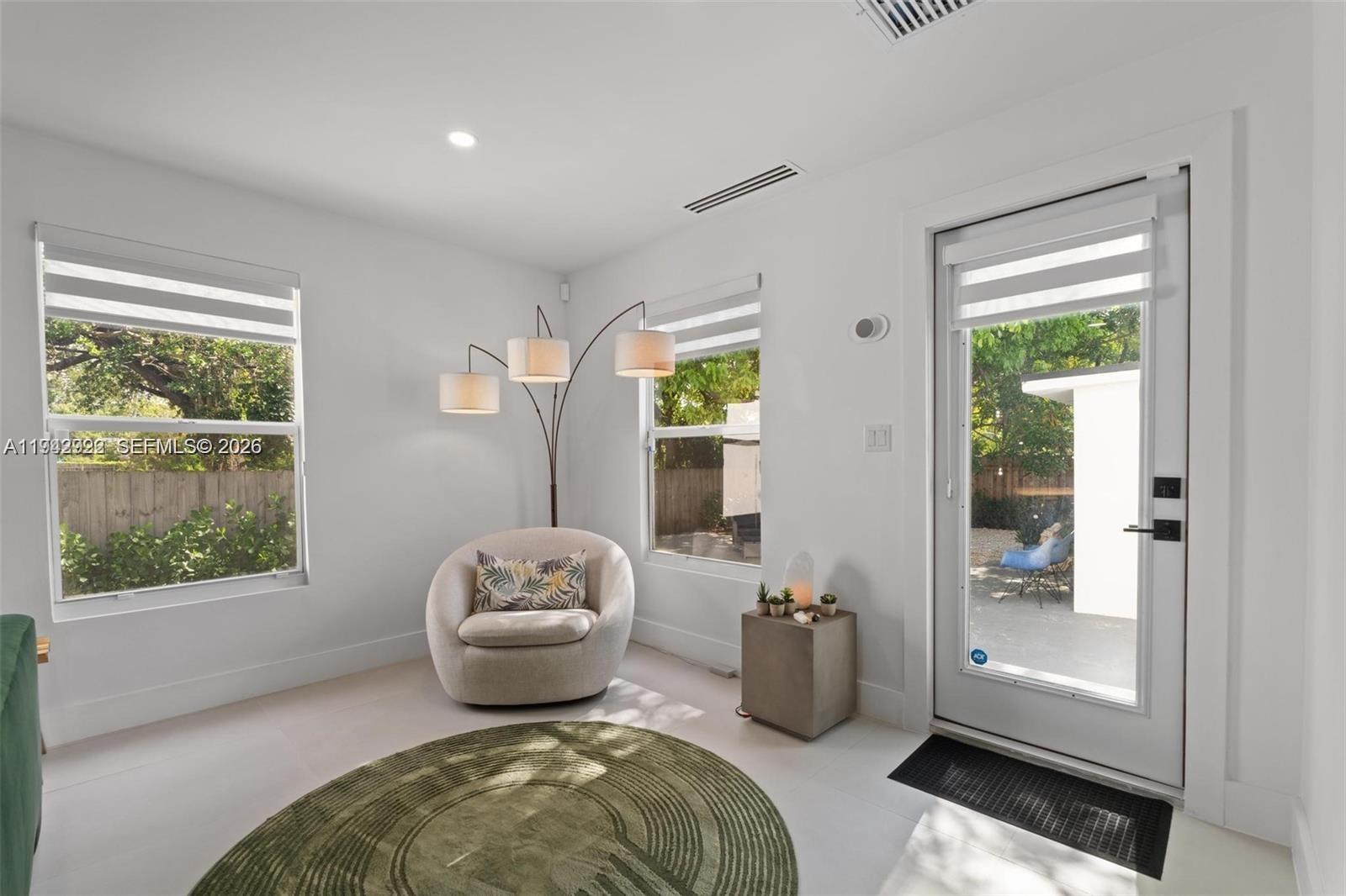 4430 Northwest 1st Avenue Miami, FL 33127 - Photo 16 of 31 a living room with furniture and a window