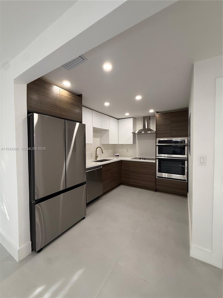 4430 Northwest 1st Avenue Miami, FL 33127 - Photo 19 of 31 a view of kitchen with refrigerator and stove