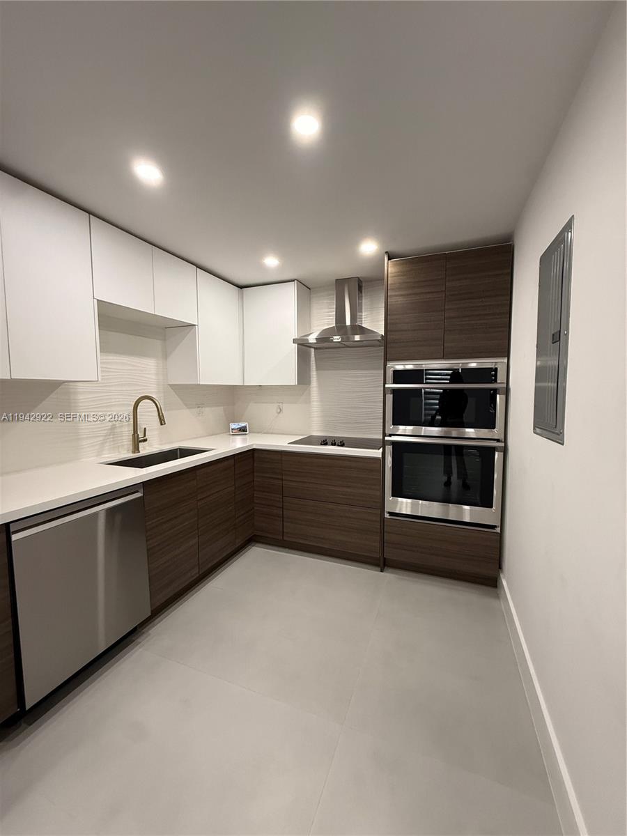 4430 Northwest 1st Avenue Miami, FL 33127 - Photo 20 of 31 a kitchen with stainless steel appliances a sink and cabinets